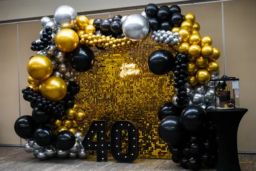 Black and gold fortieth birthday balloon wall