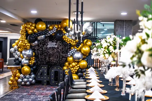 Black and gold fortieth birthday room decor