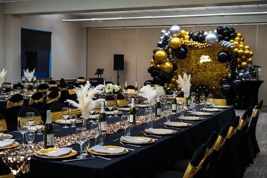 Black and gold banquet room styling