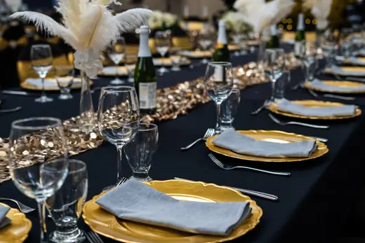 Black and gold place settings and table decor