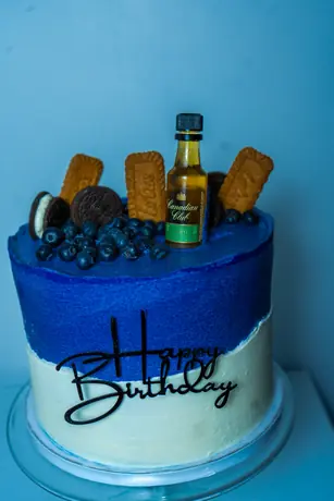 Blue birthday cake with themed details
