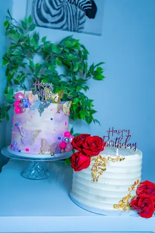 Celebration cake display with greenery