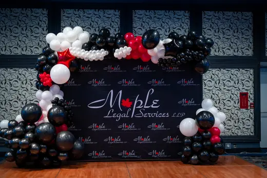Black, red and white corporate balloon backdrop