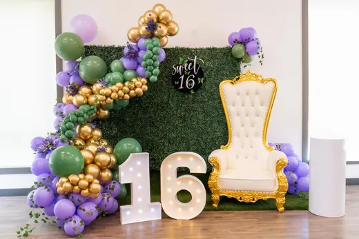 Green, purple and gold Sweet 16 balloon display