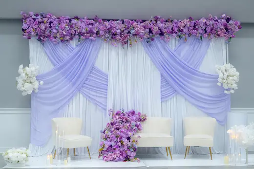 Lavender and white floral event backdrop