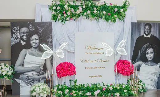 Floral memorial celebration display with family portraits