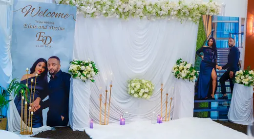 Memorial floral display with family photos