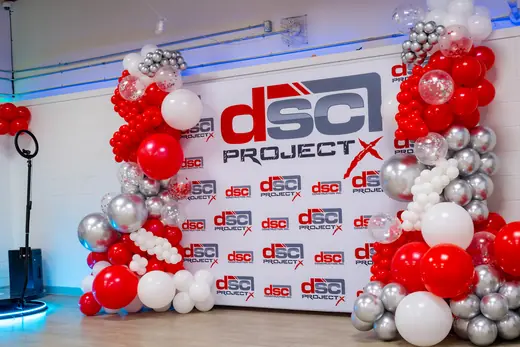 Red and white corporate balloon backdrop