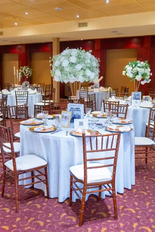 White reception tables with elegant place settings